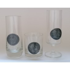 A set of german glasses of different sizes with metal emblems