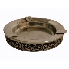 Metal ashtray with artistic ornaments