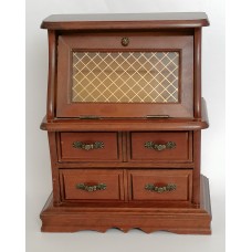 A small antique style wooden chest of drawers for jewelry and costume jewelry